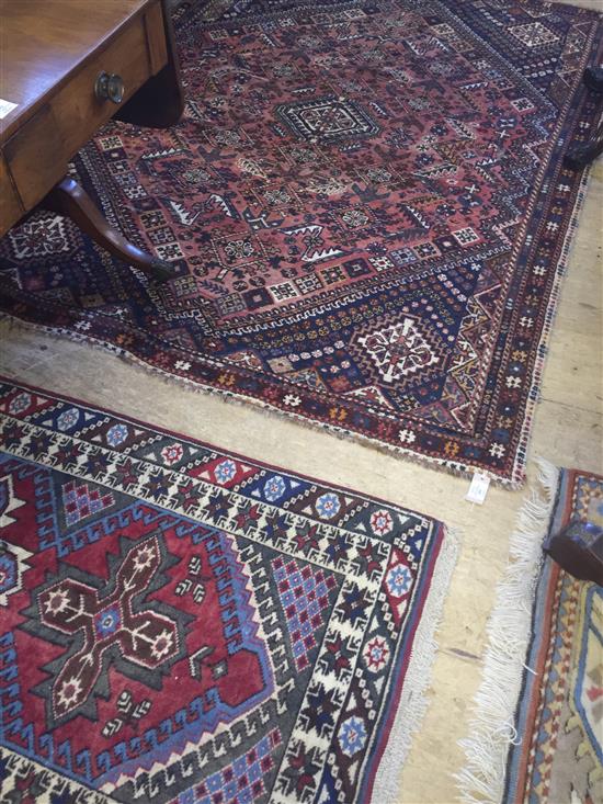 A Persian red runner & red & blue rug